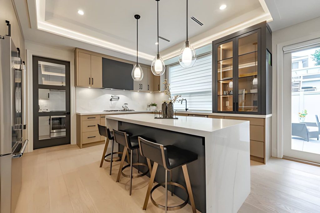 Countertop companies near me—modern kitchen with marble island, pendant lights, and sleek cabinetry.